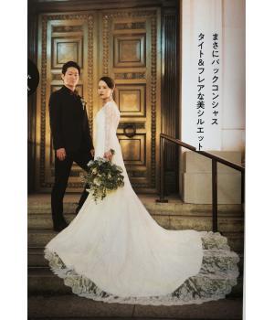 まさにバックコンシャス<br>タイト＆フレアな美シルエット<br><br>シルエットの美しさも決め手のひとつ。<br>総レースのトレーンがたっぷりと広がる<br>印象的なバックスタイルがフォトジェニック。<br>